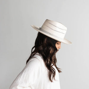 Arlo is an elevated straw fedora. Its teardrop crown + stiff upturned brim feature handwoven venting for a breezy feel + textured look. Arlo includes a hand-sewn leather band that is easily layered with other accessories. 