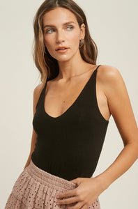 This black, v-neck, cami is versatile and stylish piece that can be dressed up or down depending on the occasion. 